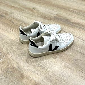 Veja V-10 white leather sneaker with black ‘V’ detail.